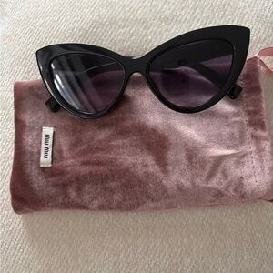 Miu Miu Black Sunglasses with Gold Accents